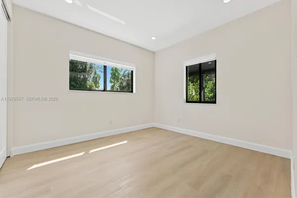 an empty room with windows