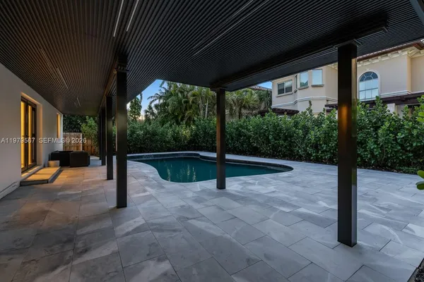 a view of swimming pool with patio