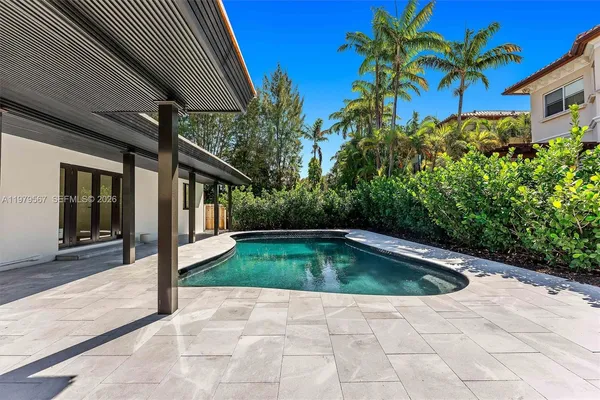 a view of a swimming pool with a garden
