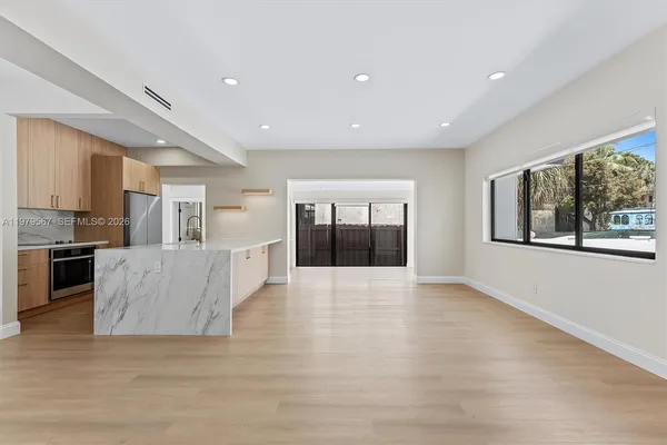 a view of kitchen with furniture and window