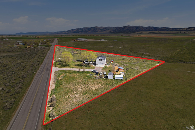 830 North Stone Road Snowville, UT 84336 - Photo 66 of 69 Overview of rural landscape featuring property boundaries highlighted and a mountain backdrop