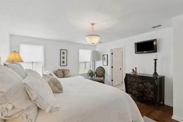 a bedroom with bed and window