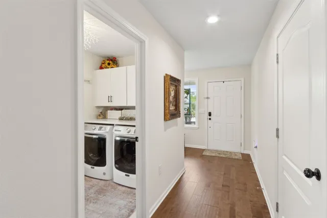 a work room with furniture and a floor to ceiling window
