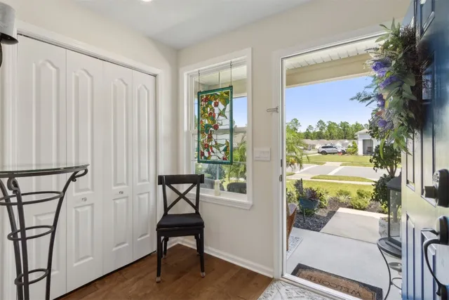 a backyard of a house with table and chairs