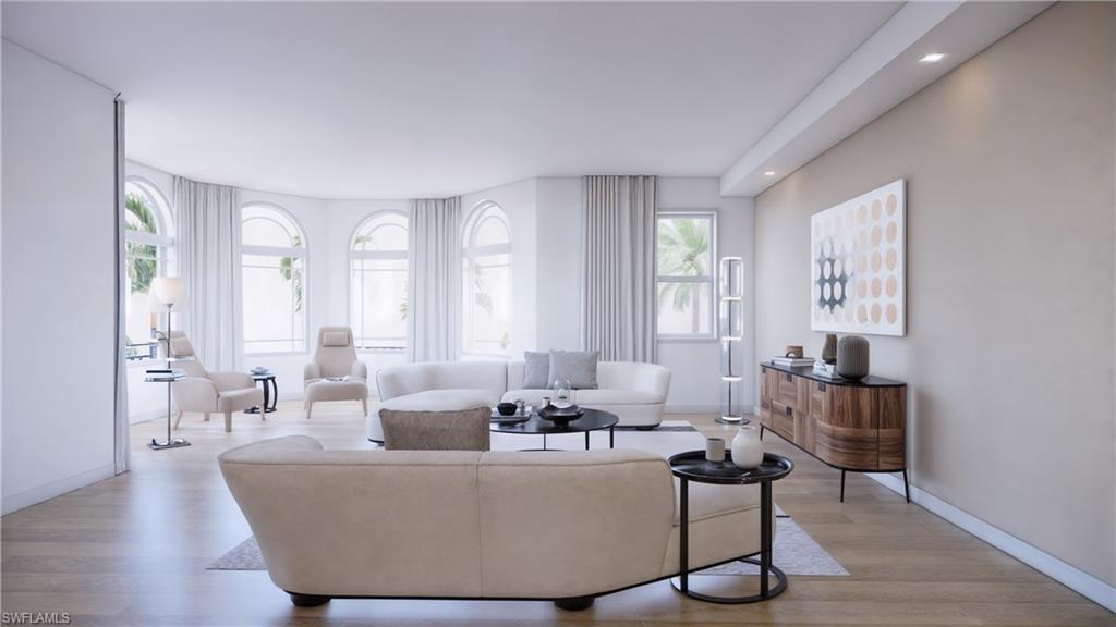 1301 3rd Avenue South, Unit 7405 Naples, FL 34102 - Photo 11 of 22 a living room with furniture and wooden floor