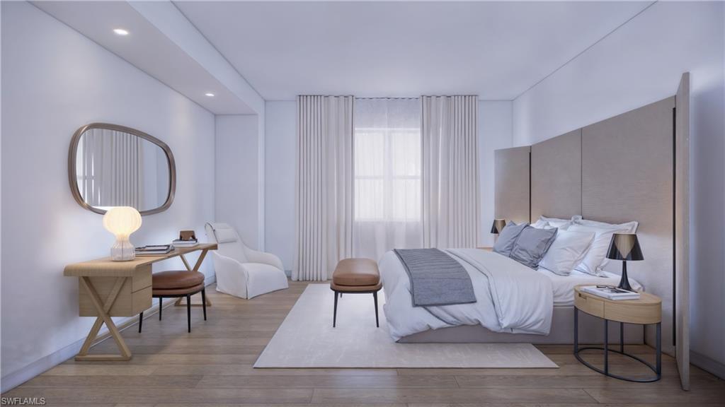 1301 3rd Avenue South, Unit 7405 Naples, FL 34102 - Photo 13 of 22 a living room with furniture a mirror and a potted plant