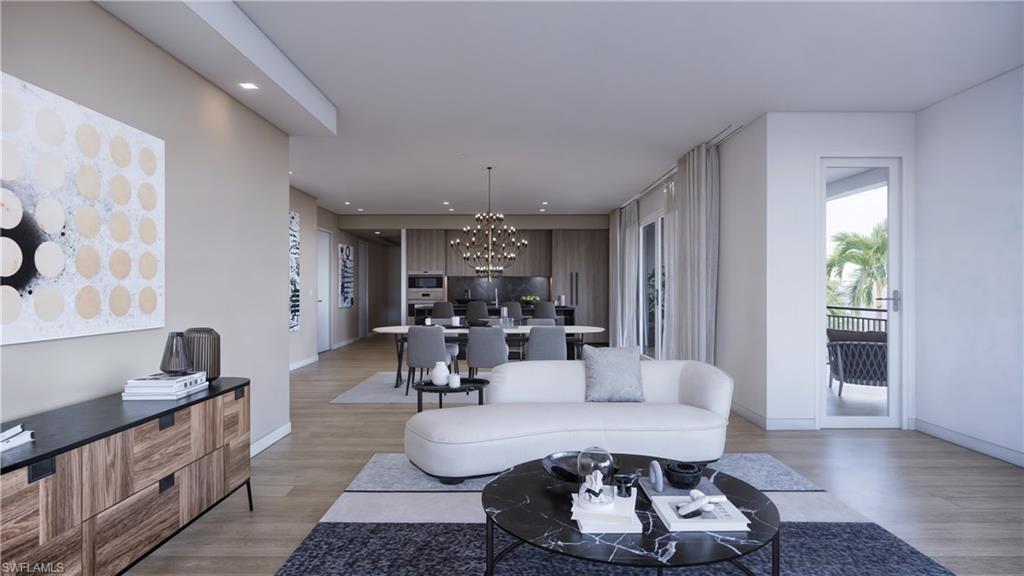 1301 3rd Avenue South, Unit 7405 Naples, FL 34102 - Photo 8 of 22 a living room with furniture and wooden floor