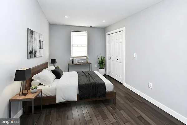 a bedroom with bed and window