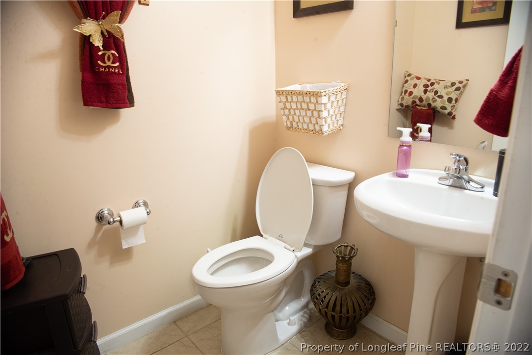 200 Lattimore Road Cameron, NC 28326 - Photo 12 of 32 a bathroom with a toilet sink and mirror