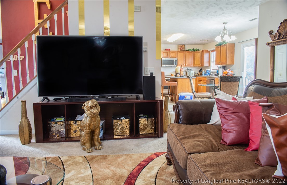 200 Lattimore Road Cameron, NC 28326 - Photo 17 of 32 a living room with furniture and a flat screen tv