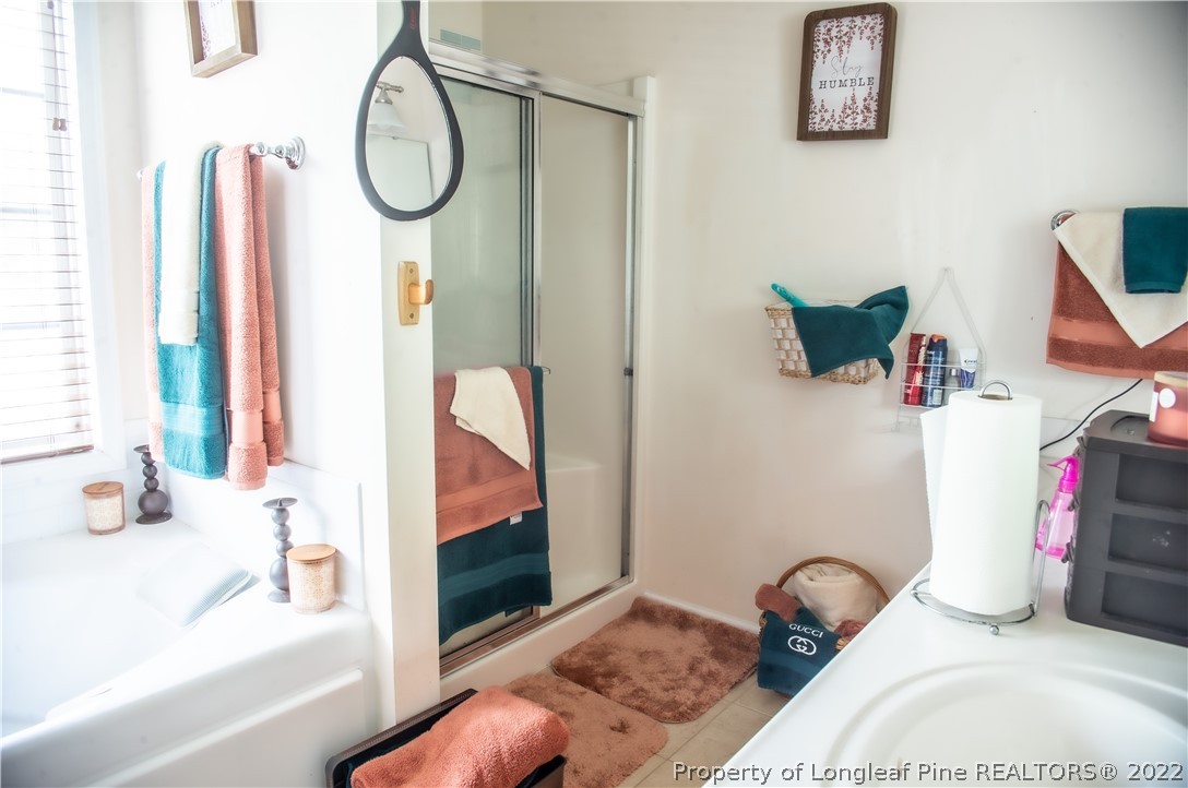 200 Lattimore Road Cameron, NC 28326 - Photo 30 of 32 a bathroom with a tub and a shower