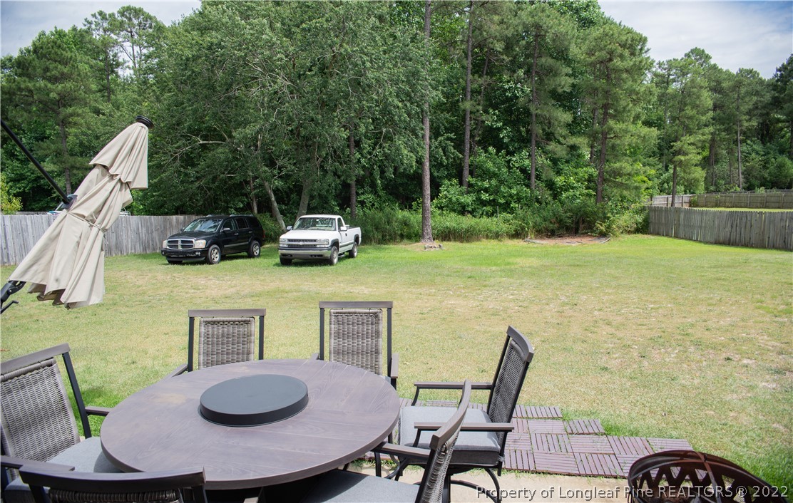 200 Lattimore Road Cameron, NC 28326 - Photo 31 of 32 a view of a dining room with furniture and wooden floor