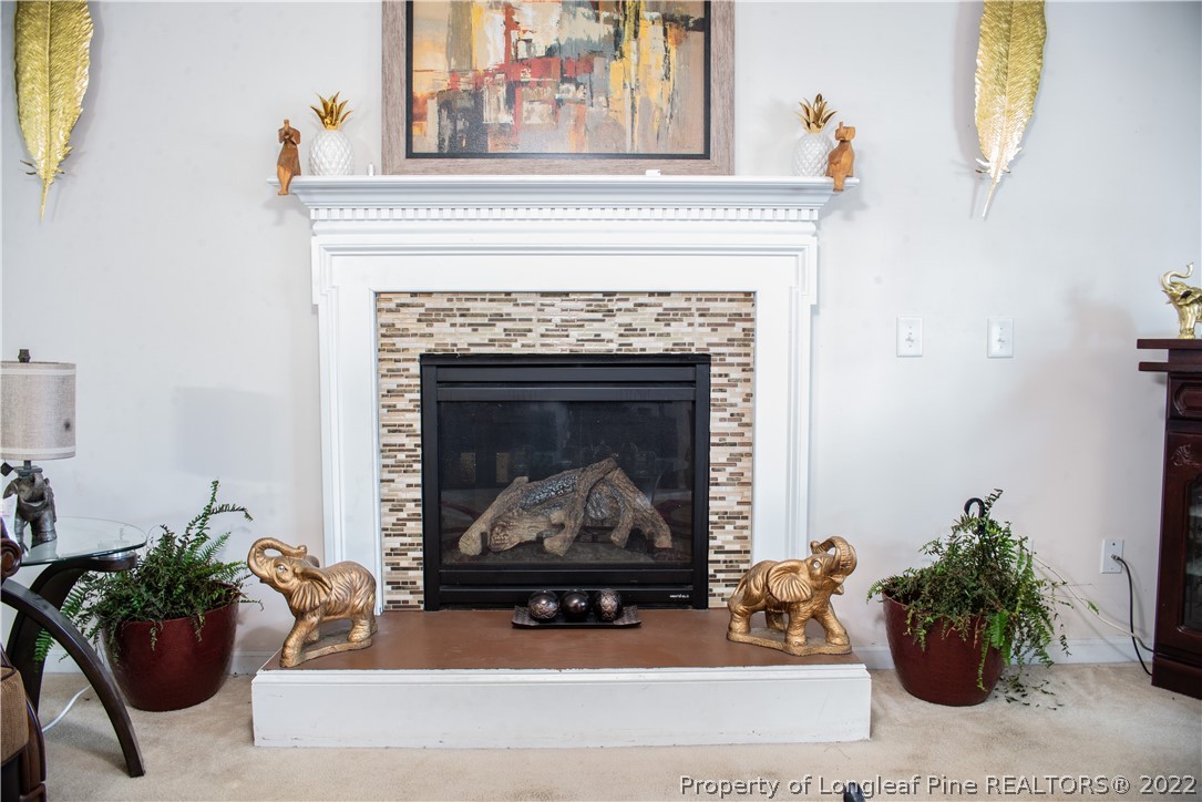 200 Lattimore Road Cameron, NC 28326 - Photo 7 of 32 a living room with furniture and a fireplace
