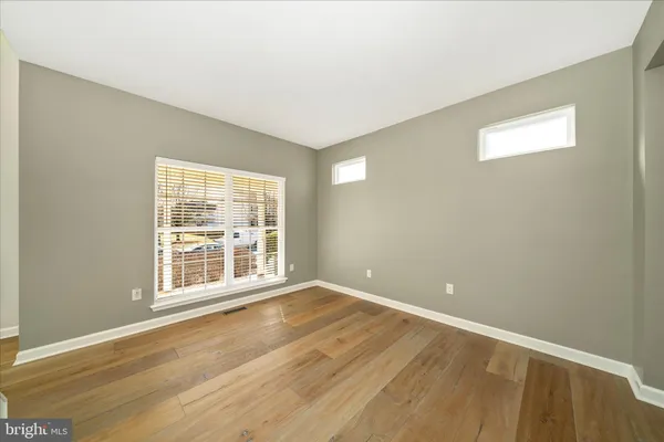 a kitchen with stainless steel appliances kitchen island granite countertop a table and chairs
