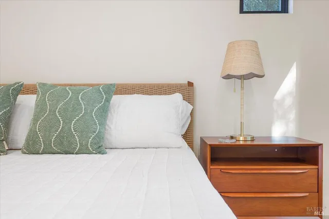 a room with a bed and a lamp