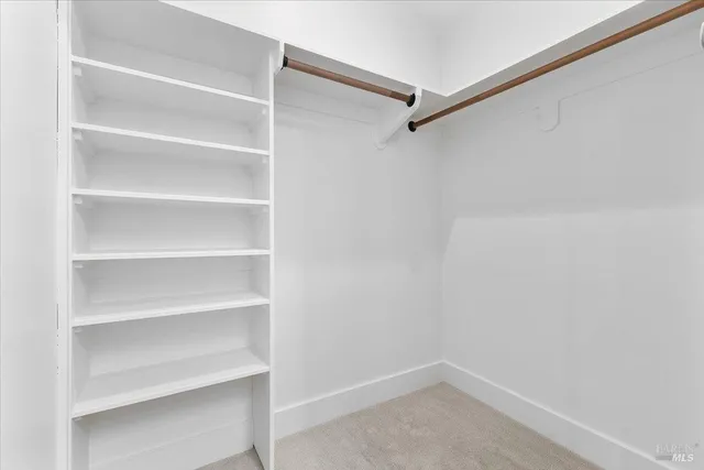 a view of an empty walk in closet