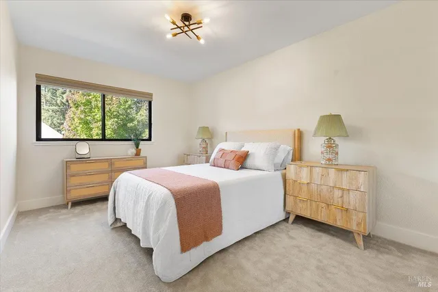 a bed room with a bed and a dresser