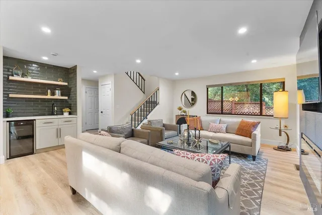 a living room with furniture and a large window