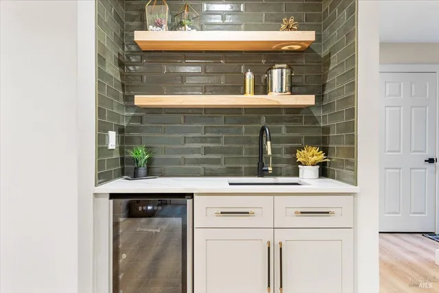 a kitchen with a sink and cabinets