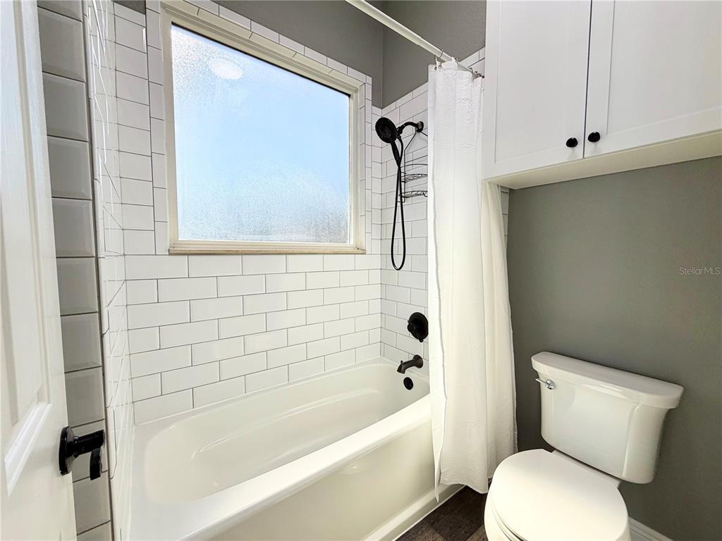 5243 West Lake Butler Road Windermere, FL 34786 - Photo 27 of 43 a bathroom with a toilet and a bathtub