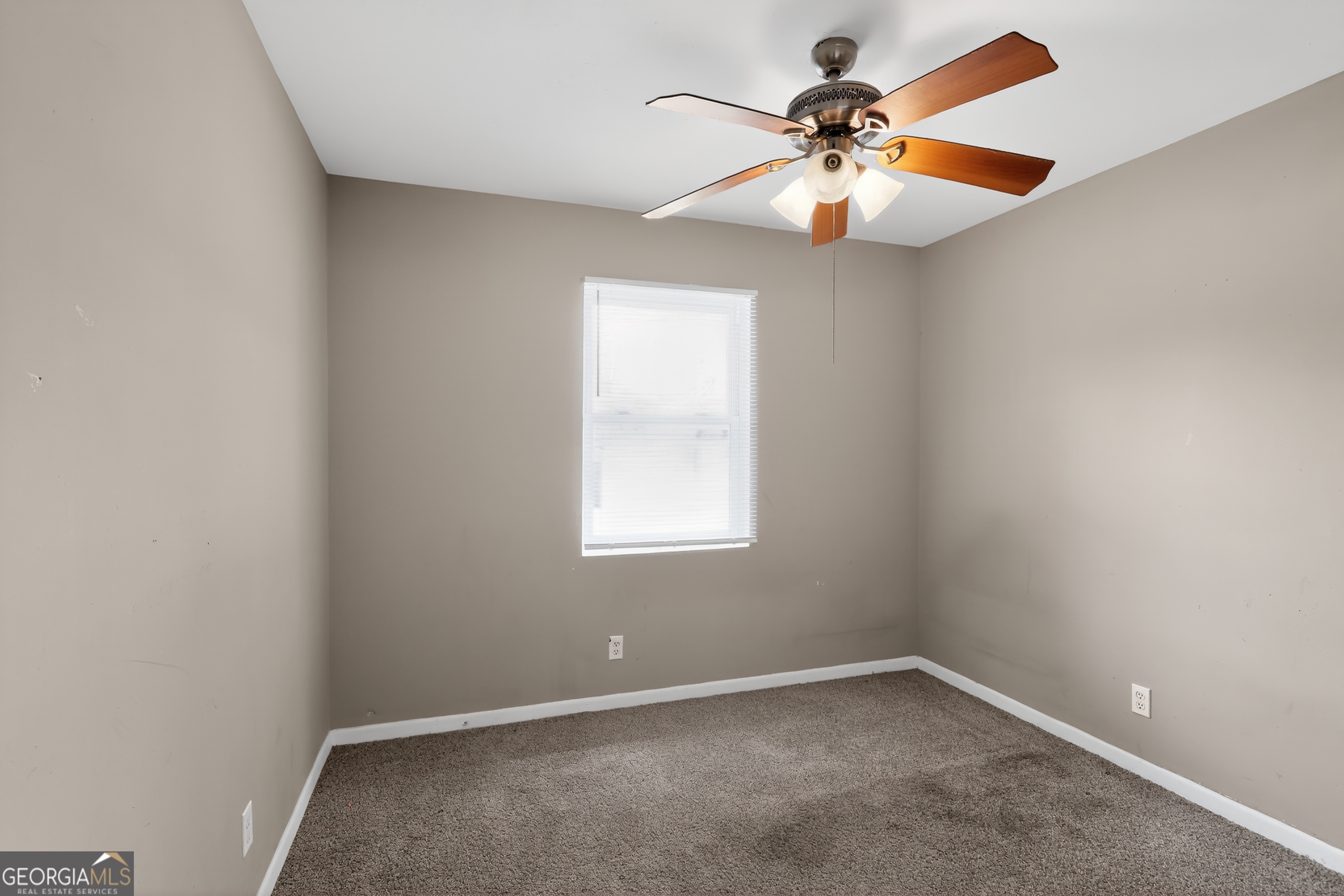 3606 Alene Circle Augusta, GA 30906 - Photo 8 of 30 an empty room with a window and a fan