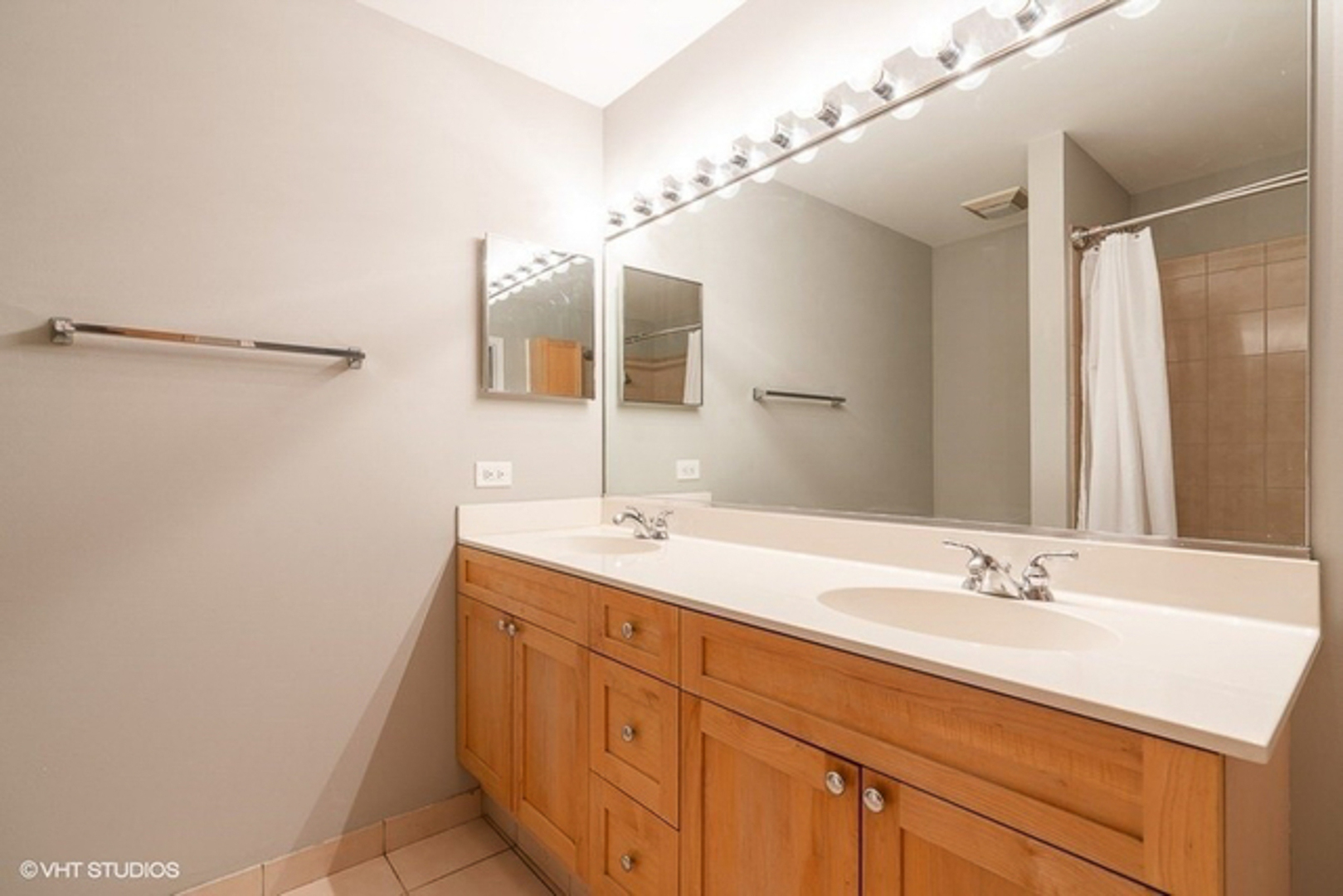 520 West Huron Street, Unit 116 Chicago, IL 60654 - Photo 17 of 28 a bathroom with a sink double vanity and a mirror