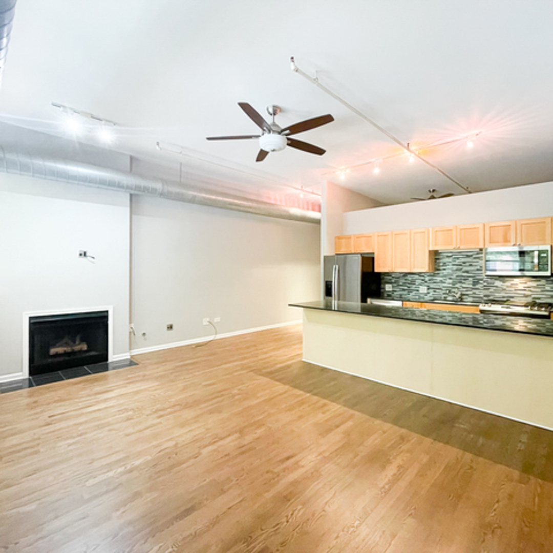 520 West Huron Street, Unit 116 Chicago, IL 60654 - Photo 6 of 28 a view of a room with a kitchen