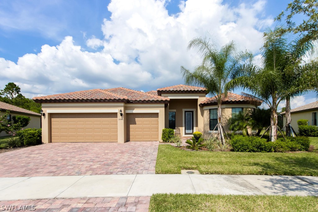 10866 Rutherford Road Fort Myers, FL 33913 - Photo 1 of 25 a front view of a house with garden