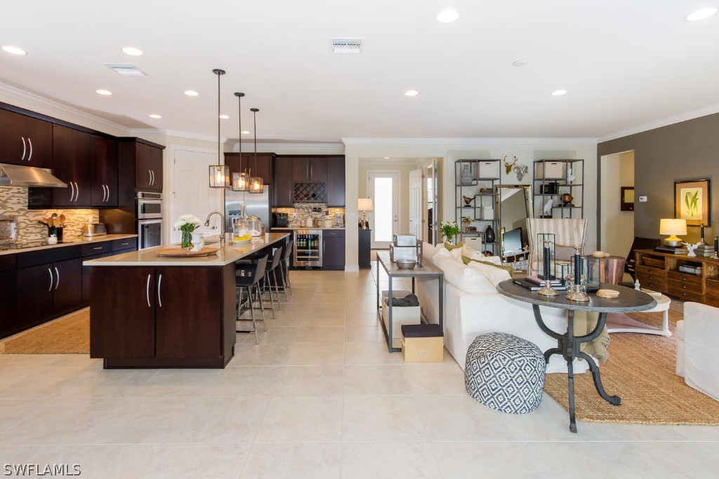 10866 Rutherford Road Fort Myers, FL 33913 - Photo 3 of 25 a large kitchen with a table and chairs