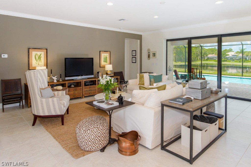10866 Rutherford Road Fort Myers, FL 33913 - Photo 4 of 25 a living room with furniture and a flat screen tv