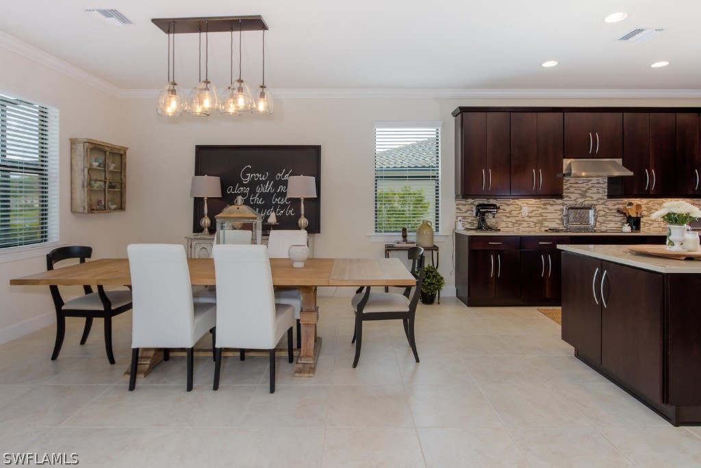 10866 Rutherford Road Fort Myers, FL 33913 - Photo 8 of 25 a large kitchen with a table and chairs in it