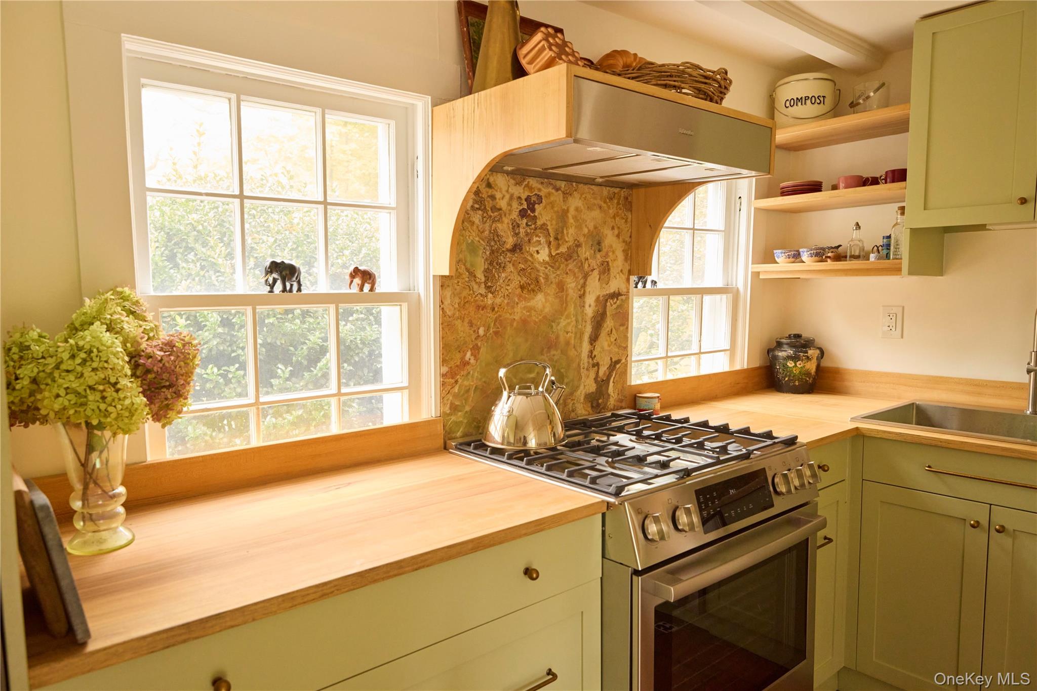 521 Barrett Hill Road Mahopac, NY 10541 - Photo 16 of 35 a kitchen with a stove and a window