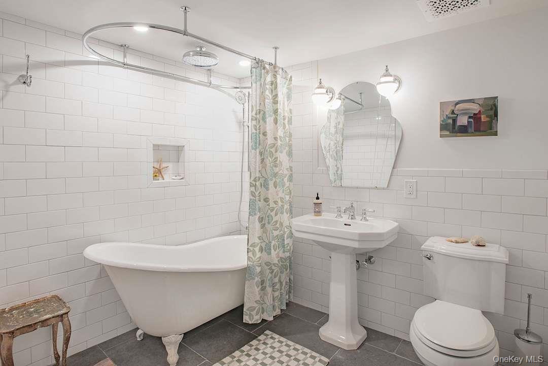 521 Barrett Hill Road Mahopac, NY 10541 - Photo 24 of 35 a bathroom with a sink toilet and shower