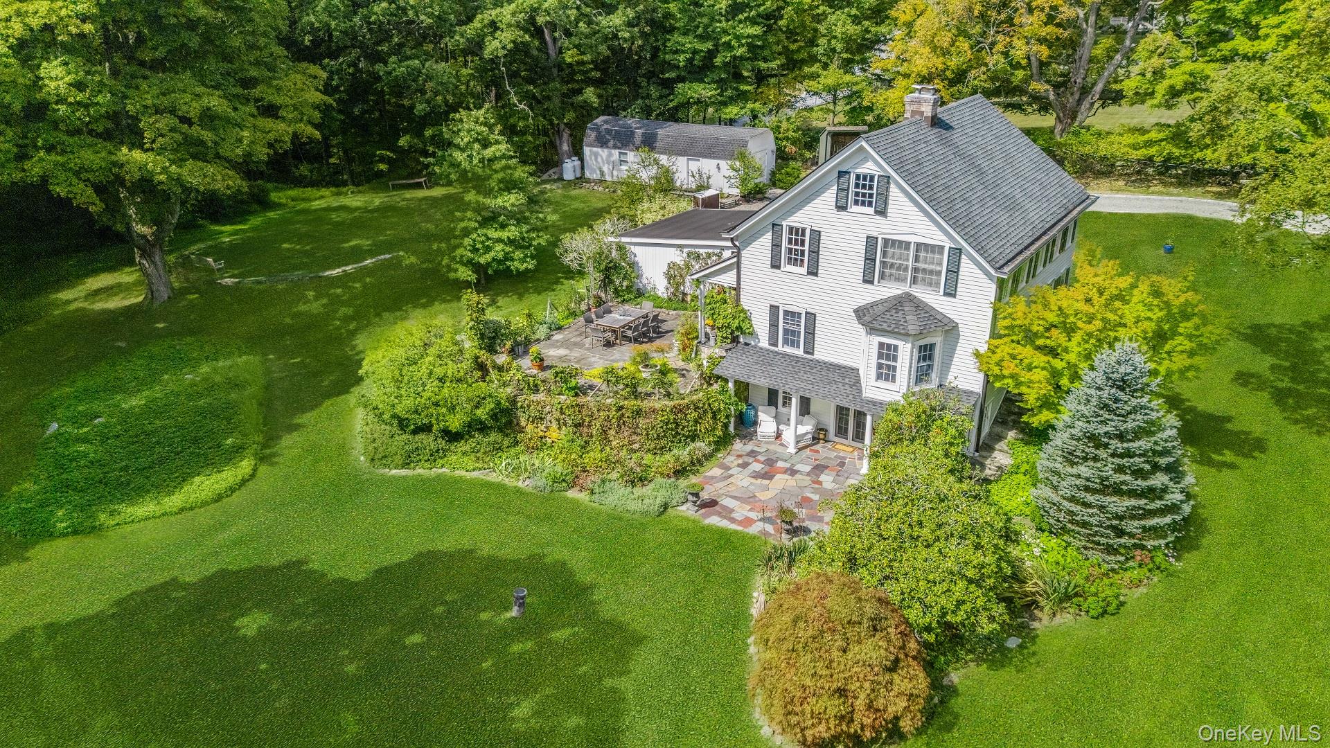 521 Barrett Hill Road Mahopac, NY 10541 - Photo 32 of 35 a aerial view of a house with a yard and large trees