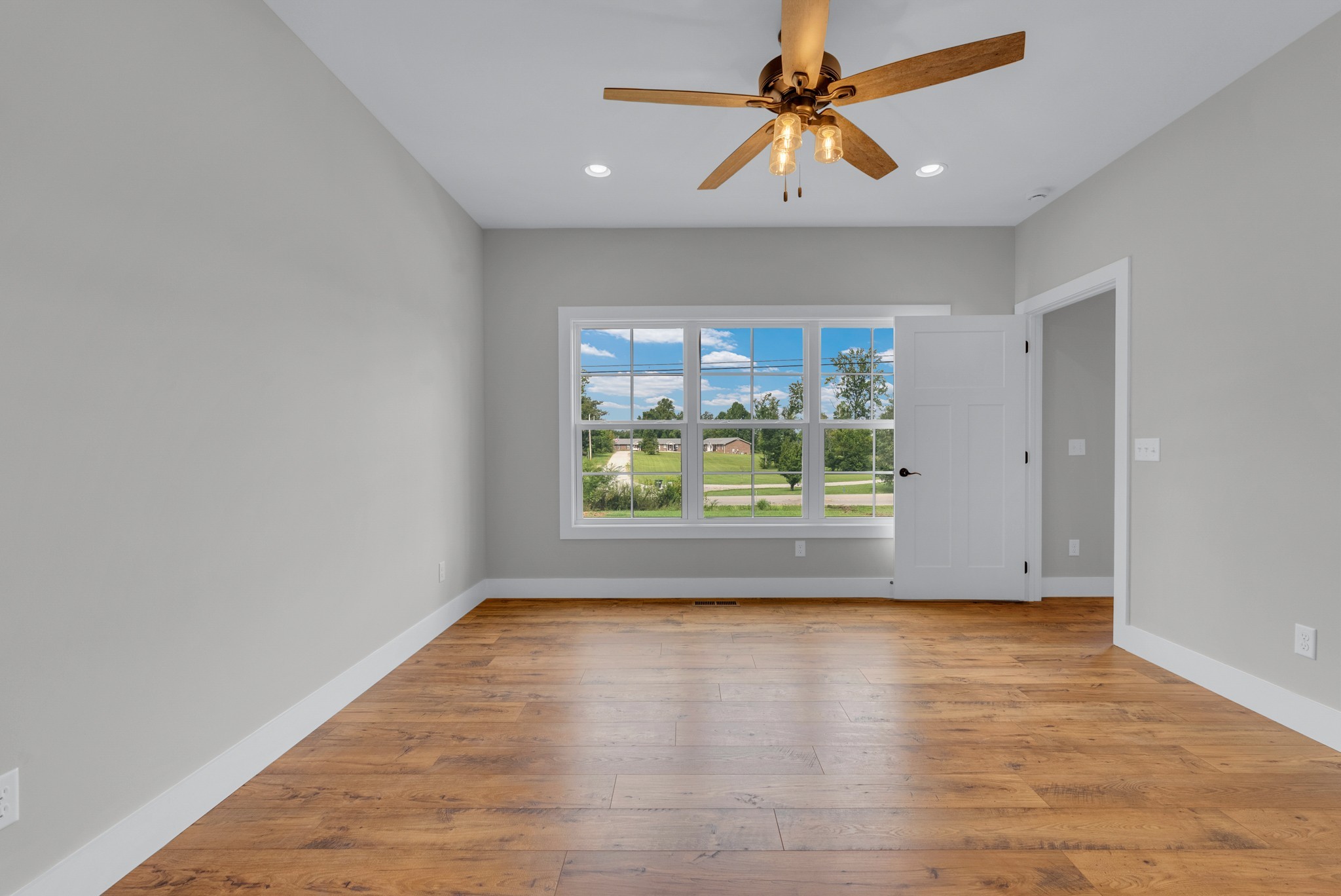 270 Locust Grove Road Cookeville, TN 38501 - Photo 14 of 34 a view of room with window ceiling fan and hardwood floor
