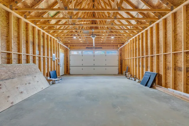 a view of a room with wooden stairs