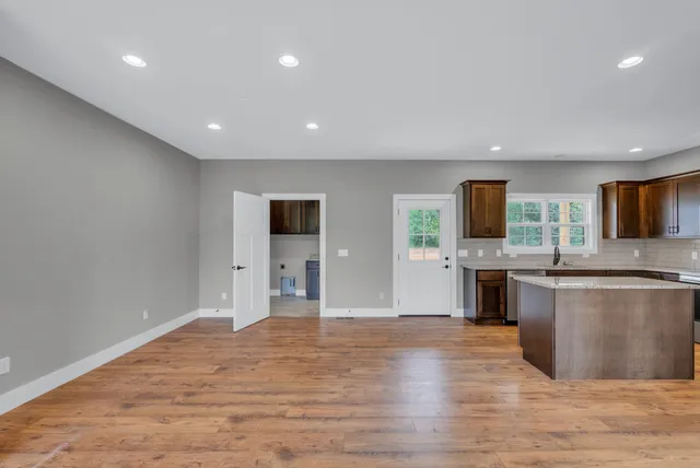 a view of a kitchen with microwave and cabinets