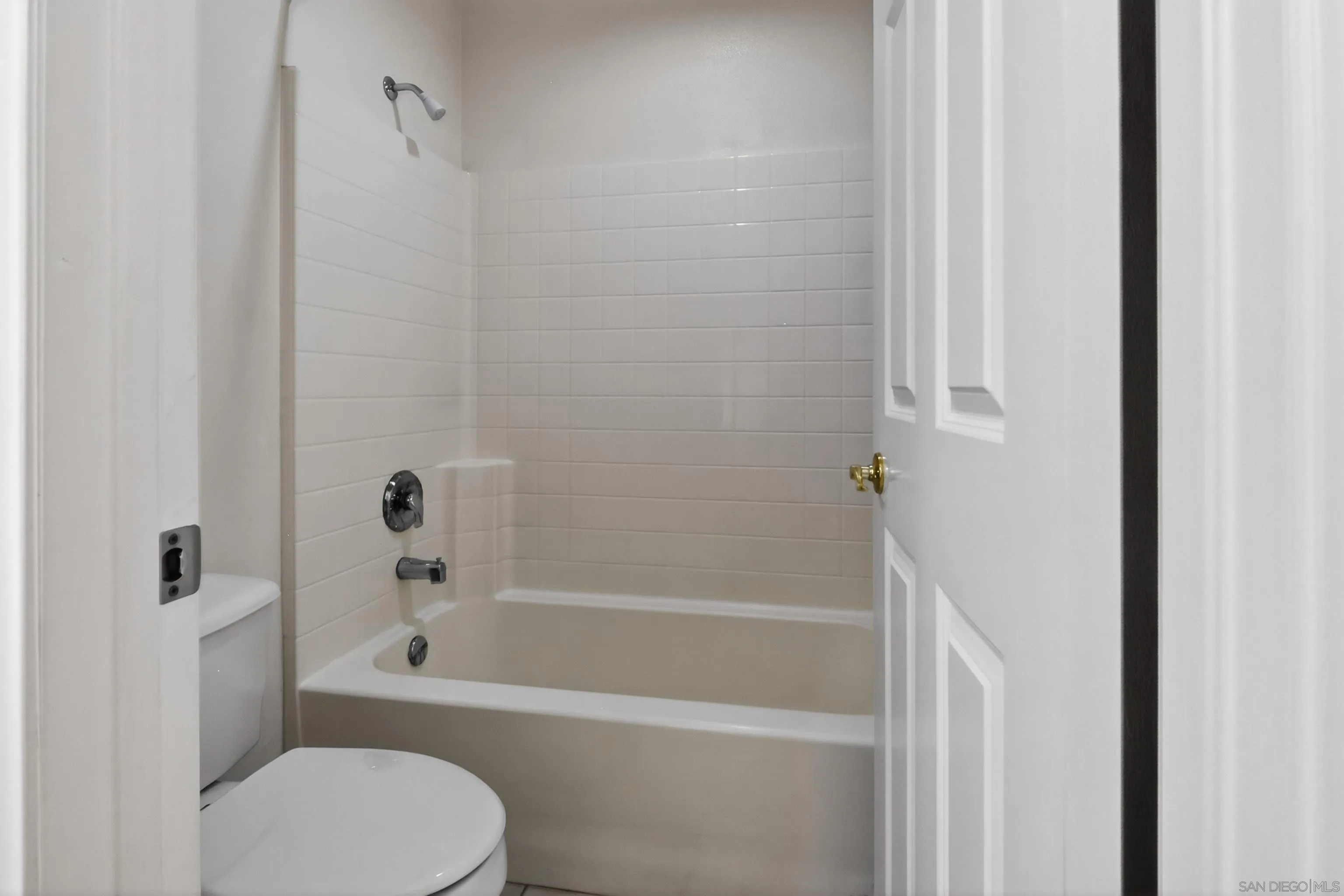 1432 Belmont Park Road Oceanside, CA 92057 - Photo 30 of 54 a bathroom with a toilet and a bathtub