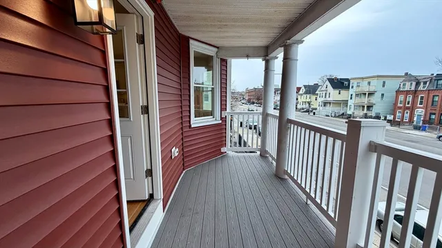 a view of a balcony with wooden floor