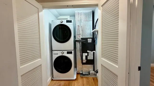a view of a hallway with washer and dryer
