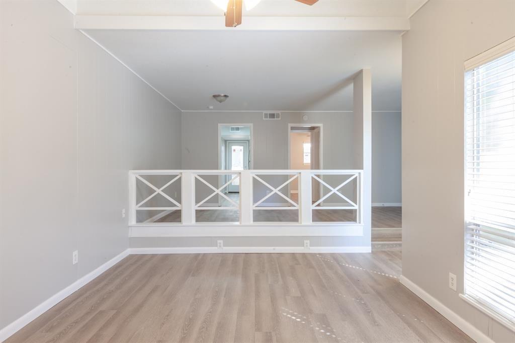 3409 Grooms Street Austin, TX 78705 - Photo 5 of 11 an empty room with wooden floor and windows