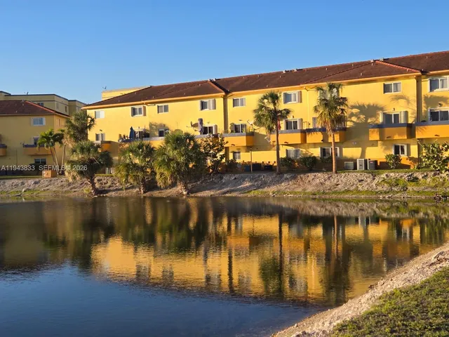 a view of swimming pool with outdoor seating