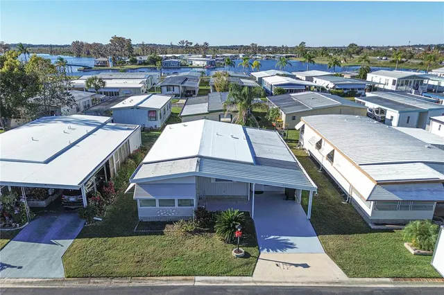 an aerial view of a house with garden space and street view
