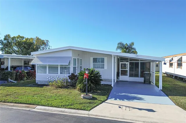 a front view of a house with a yard and porch
