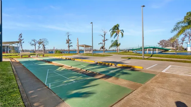 a view of a livingroom with furniture and a bookshelf