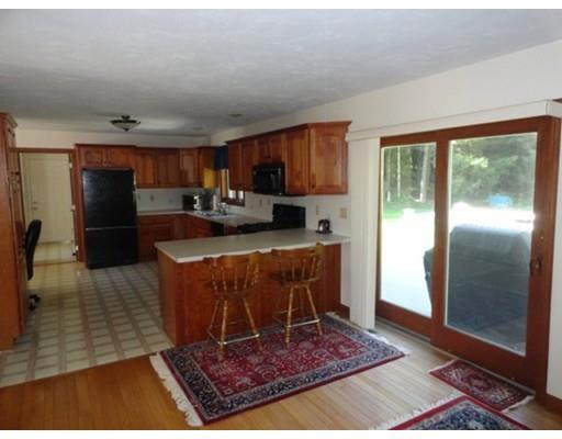 149 South Row Road Townsend, MA 01469 - Photo 8 of 34 a living room with stainless steel appliances furniture a rug and a window