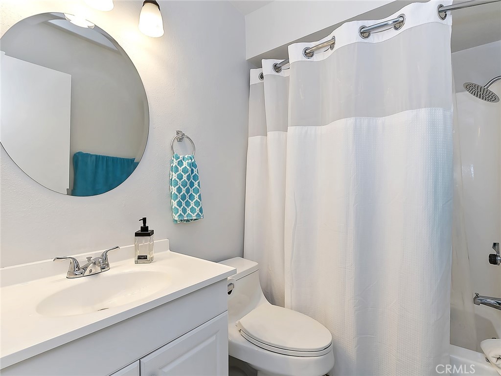 82294 Bergman Drive Indio, CA 92201 - Photo 12 of 22 a bathroom with a sink vanity mirror and toilet
