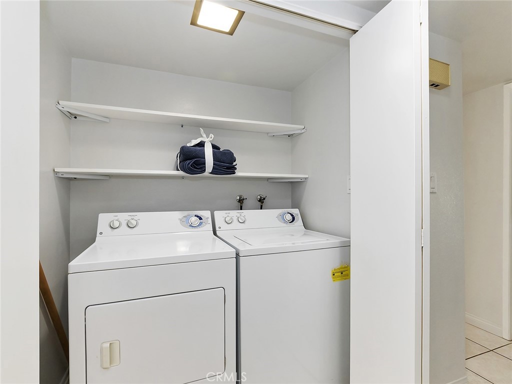 82294 Bergman Drive Indio, CA 92201 - Photo 13 of 22 a utility room with dryer and washer
