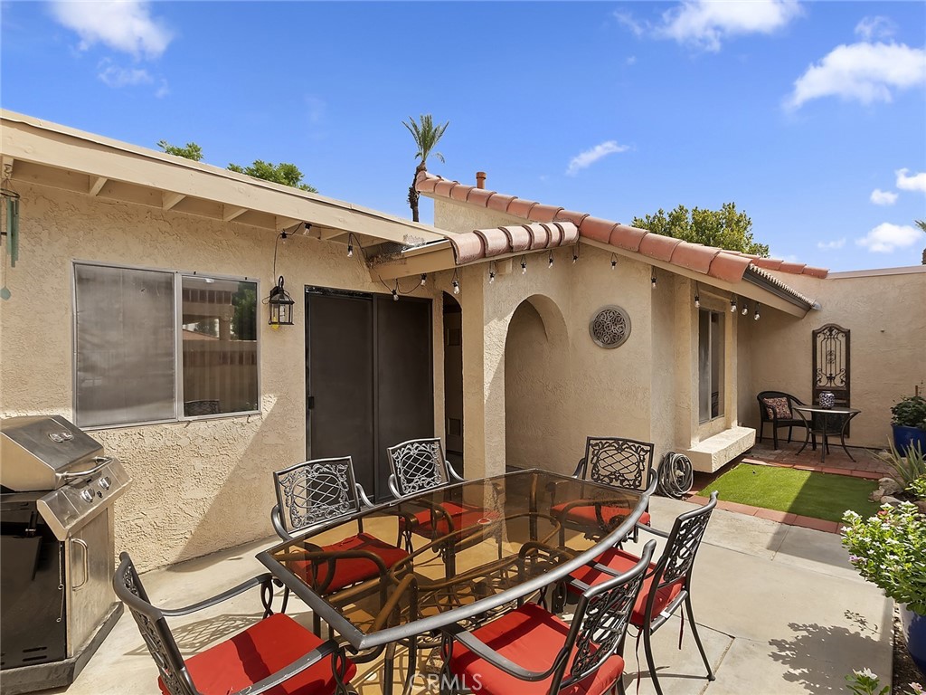 82294 Bergman Drive Indio, CA 92201 - Photo 15 of 22 a view of house with patio outdoor dining space and furniture