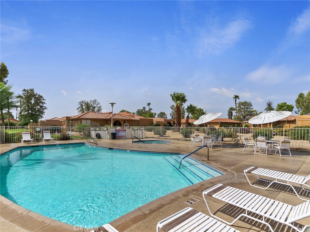 82294 Bergman Drive Indio, CA 92201 - Photo 21 of 22 a view of a swimming pool and lounge chairs